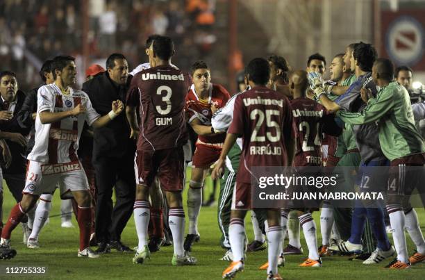 Brazil's Fluminense and Argentina's Argentinos Juniors footballer fight at the end of the Copa Libertadores 2011 group 3 football match at Diego...