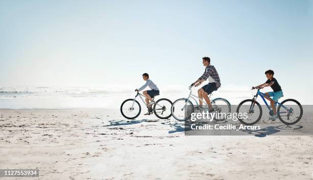 summers are for making deposits in the family memory bank - family bicycle stock pictures, royalty-free photos & images