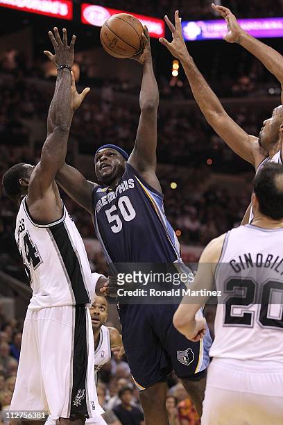 Forward Zach Randolph of the Memphis Grizzlies takes a shot against Antonio McDyess of the San Antonio Spurs in Game Two of the Western Conference...