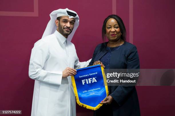 In this handout image released by FIFA World Cup Qatar 2022 LLC, Senior Qatar World Cup and FIFA officials announce a new joint venture to deliver...