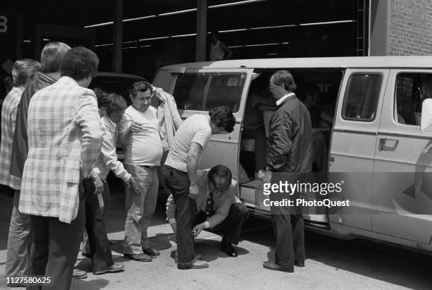 Following a raid, agents from the United States Immigration and Naturalization Service search suspected undocumented immigrants, Chicago, Illinois,...