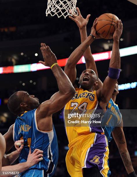 Kobe Bryant of the Los Angeles Lakers goes up for a shot over Carl Landry of the New Orleans Hornets in Game Two of the Western Conference...