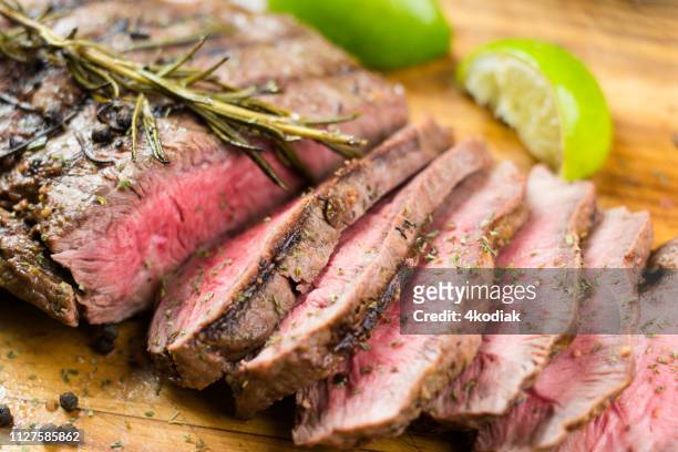 juicy grilled flank steak - beef stock pictures, royalty-free photos & images