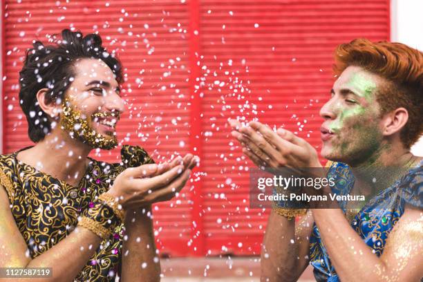 blowing confetti - man make up stock pictures, royalty-free photos & images
