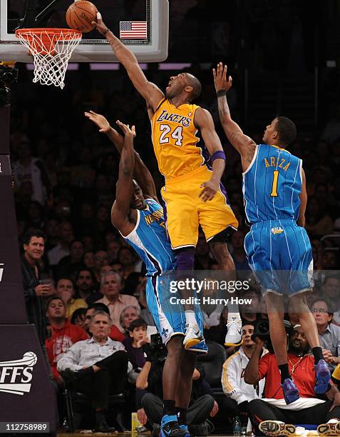 Kobe Bryant of the Los Angeles Lakers goes up for a dunk over Emeka Okafor of the New Orleans Hornets in Game Two of the Western Conference...