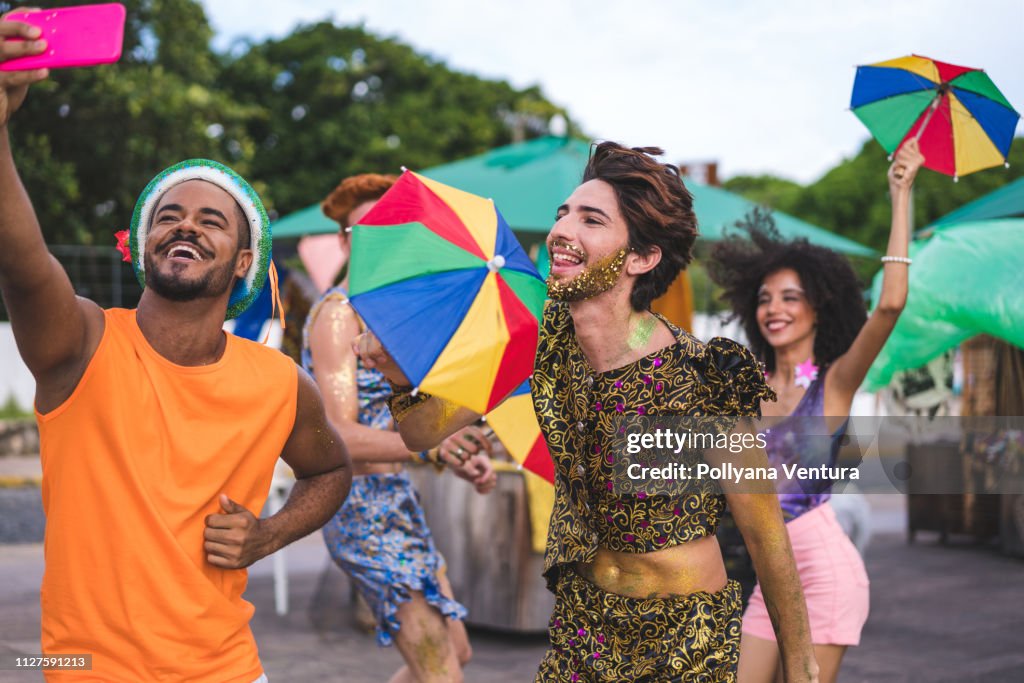 Friends dancing and taking a selfie