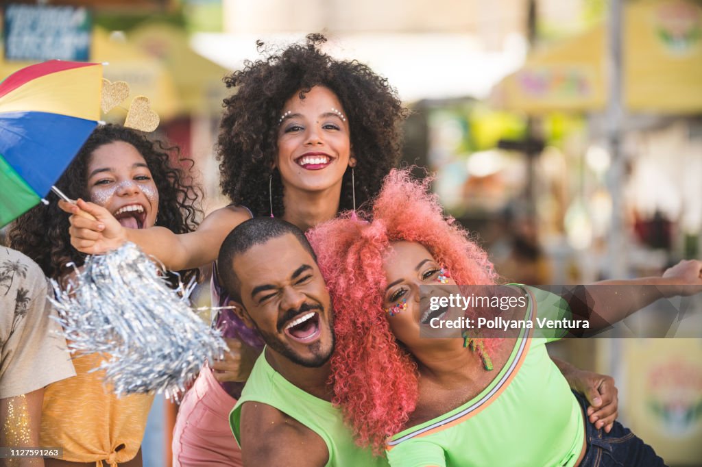 Friends celebrating street Carnival