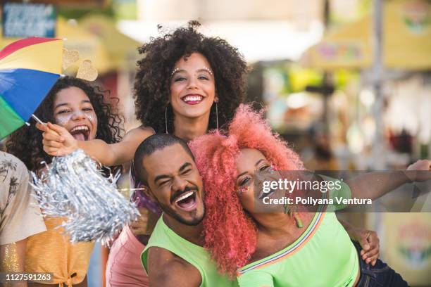 friends celebrating street carnival - carneval stock pictures, royalty-free photos & images