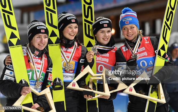 February 2019, Austria, Seefeld: Ski jumping - team jumping, ladies. Ingebjoerg Saglien Braaten , Silje Opseth, Anna Odine Ström and Maren Lundby...