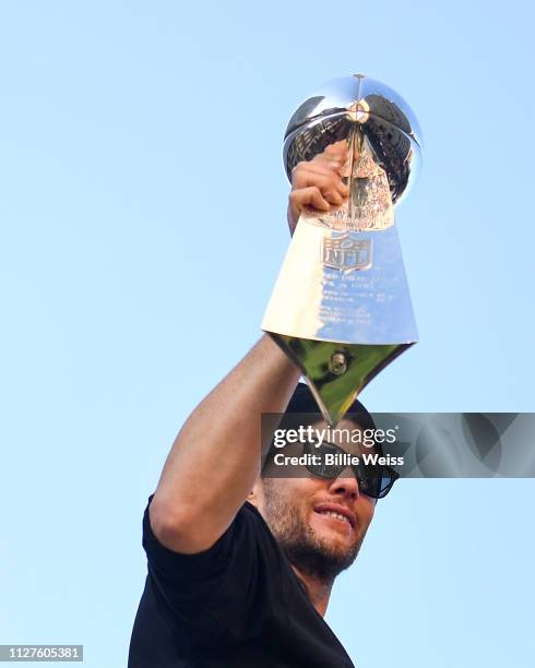 Tom Brady of the New England Patriots holds the Vince Lombardi trophy during the Super Bowl Victory Parade on February 05, 2019 in Boston,...