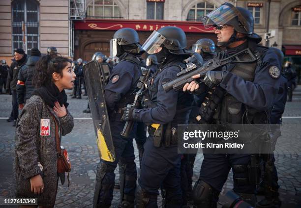 An angry protestor confronts French Riot Police after peaceful demonstrations, which were part of National General Strike along the Rue de Rivoli,...