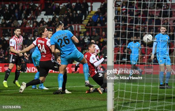 Sergi Canos of Brentford scores his sides first goal during the FA Cup Fourth Round Replay match between Brentford and Barnet at Griffin Park on...