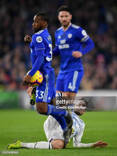 Junior Hoilett of Cardiff City is tackled by Morgan Schneiderlin of Everton during the Premier League match between Cardiff City and Everton FC at...
