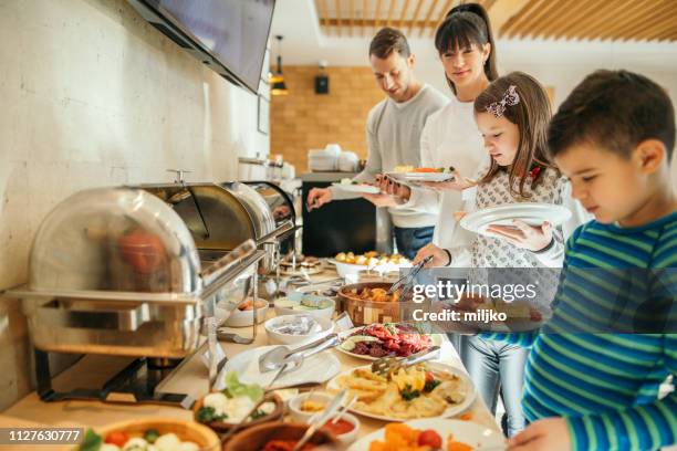 family at breakfast in hotel restaurant - breakfast buffet stock pictures, royalty-free photos & images