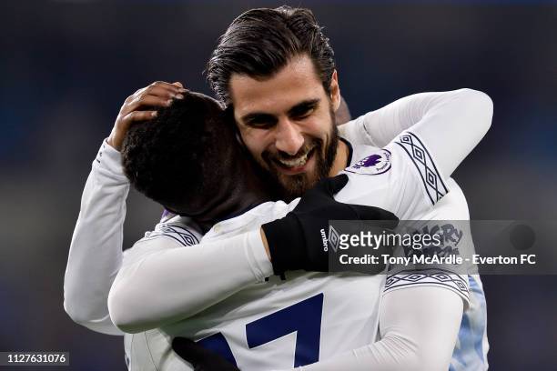Idrissa Gueye and Andre Gomes of Everton embrace during the Premier League match between Cardiff City and Everton at The Cardiff City Stadium on...