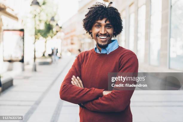 portrait of young smiling afro-american man - charm man stock pictures, royalty-free photos & images