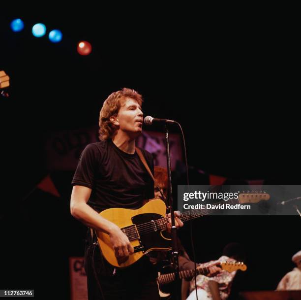 Tom Robinson, British singer-songwriter, during a live concert performance on stage in London, England, Great Britain, in October 1984.