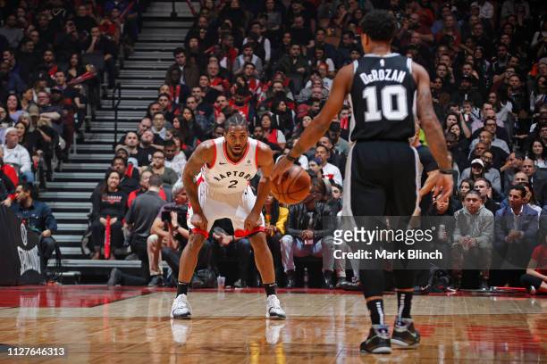 DeMar DeRozan of the San Antonio Spurs handles the ball against Kawhi Leonard of the Toronto Raptors on February 22, 2019 at the Scotiabank Arena in...