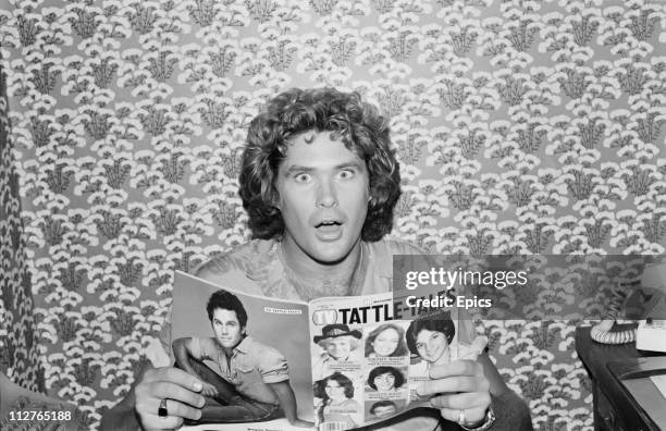 American television actor David Hasselhoff looks surprised as he poses with a copy of 'Tattle-Tales' magazine in New York, 1981. Hasselhoff is well...