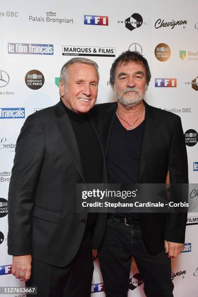 Actor Yves Renier and director Olivier Marchal attend the 26th "Trophees Du Film Francais" Photocall at Palais Brongniart on February 05, 2019 in...