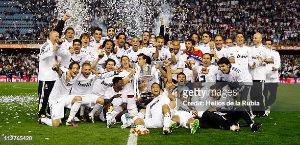 Real Madrid players celebrate with the Copa del Rey trophy after the Copa del Rey Final between Barcelona and Real Madrid at Estadio Mestalla on...