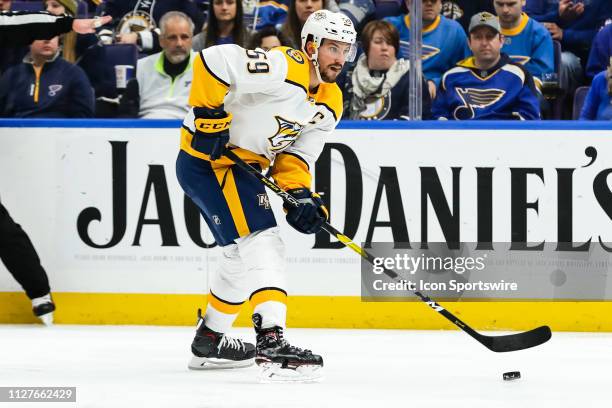 Nashville Predators' Roman Josi skates with the puck during the third period of an NHL hockey game between the St. Louis Blues and the Nashville...