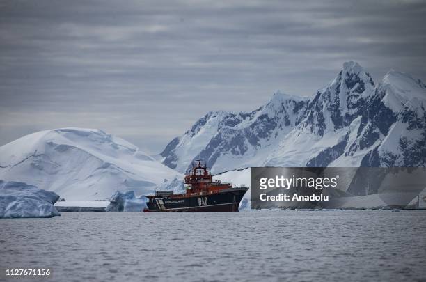 Ship anchors near icebergs for Sahika Ercumen's, an internationally renowned Turkish diver, free-diving training at Galindez Island in Antarctica on...