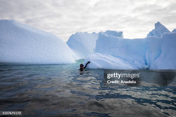 Sahika Ercumen, an internationally renowned Turkish diver, swims during her free-diving training between the icebergs near Galindez Island in...