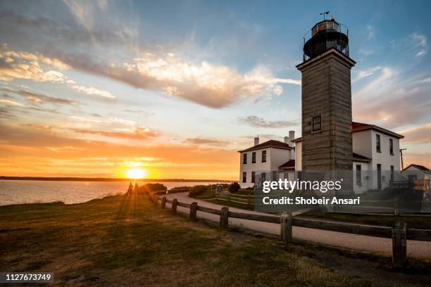 beavertail lighthouse at sunset, jamestown, rhode island - rhode island bildbanksfoton och bilder