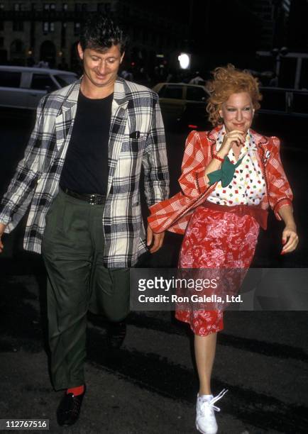 Singer Bette Midler is escorted by her husband Martin von Haselberg to the film set of "Big Business" on August 10, 1987 at The Plaza Hotel in New...