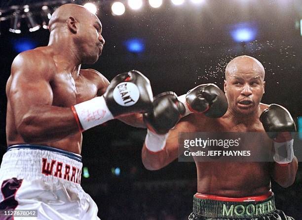 Evander Holyfield lands a left jab on Michael Moorer in the second round of their WBA/IBF Heavyweight Championship Unification fight 08 November in...