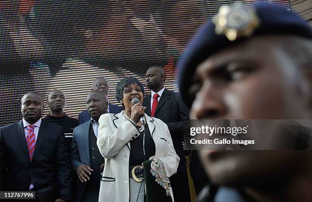 Stalwart Winnie Madikizela-Mandela, beside ANCYL president Julius Malema , addresses ANC supporters outside the high court on April 20, 2011 in...