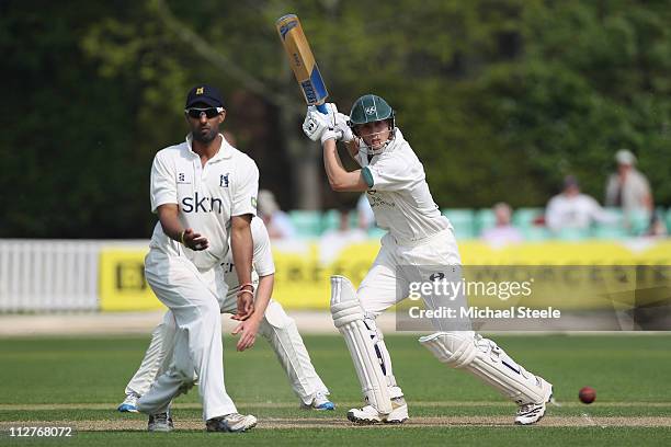 Matt Pardoe of Worcestershire hits to the offside as Varum Chopra of Warwickshire turns his back during the LV County Championship match between...