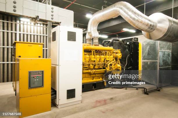 electrical power generator in large building interior - diesel imagens e fotografias de stock