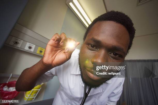 patient personal perspective ophthalmoscope medical eye exam close-up - personal perspective doctor stock pictures, royalty-free photos & images