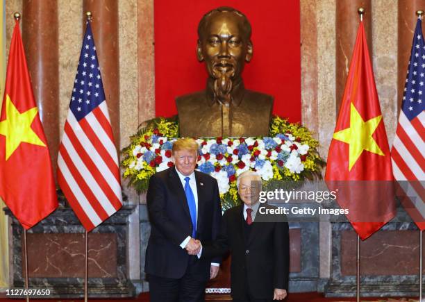 President Donald Trump and Vietnamese President Nguyen Phu Trong pose at the Presidential Palace on February 27, 2019 in Hanoi, Vietnam. U.S...