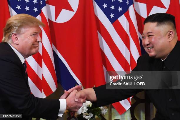 President Donald Trump speaks with North Korea's leader Kim Jong Un during a meeting at the Sofitel Legend Metropole hotel in Hanoi on February 27,...