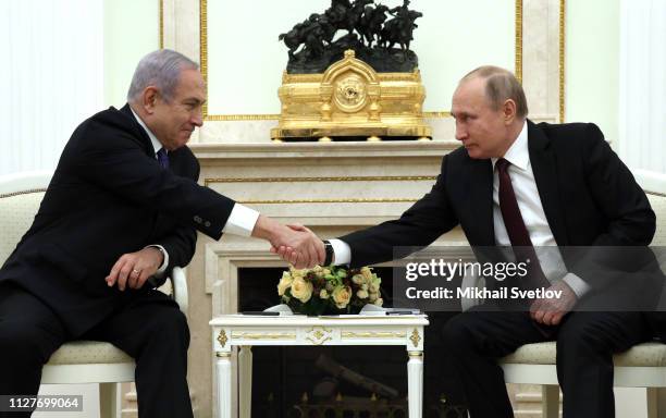 Russian President Vladimir Putin greets Israeli Prime Minister Benjamin Netanyahu during their talks at the Kremlin on February 27, 2019 in Moscow,...