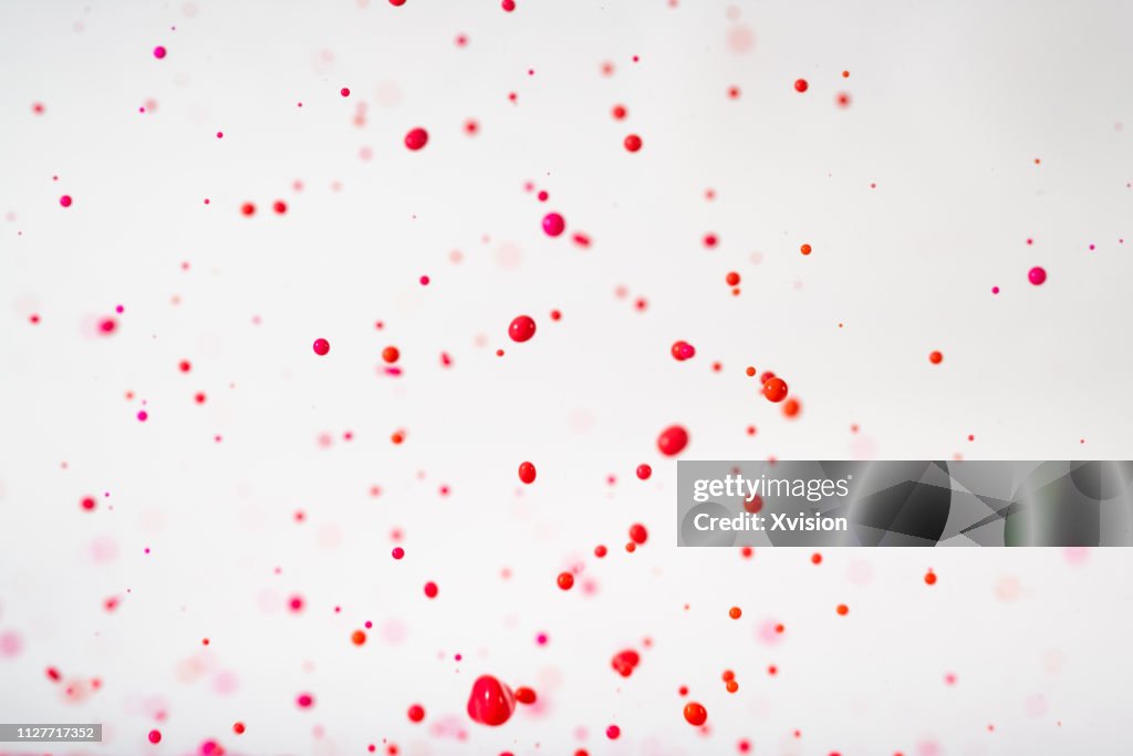Floating Particles Red Floating Red Dye In Mid Air With Group Of Small Droplets High-Res Stock ...