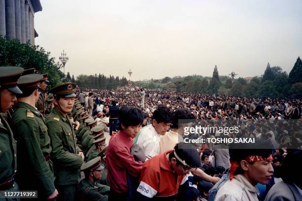 Soldiers of the People's Liberation Army guard the Great Hall of the People while Chinese senior leader Deng Xiaoping holds Sino-Soviet top-level...