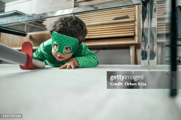 little boys playing knights at home - child in disguise stock pictures, royalty-free photos & images