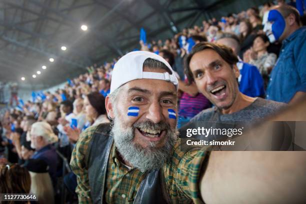spectators cheering in stadium - supporter selfie stock pictures, royalty-free photos & images