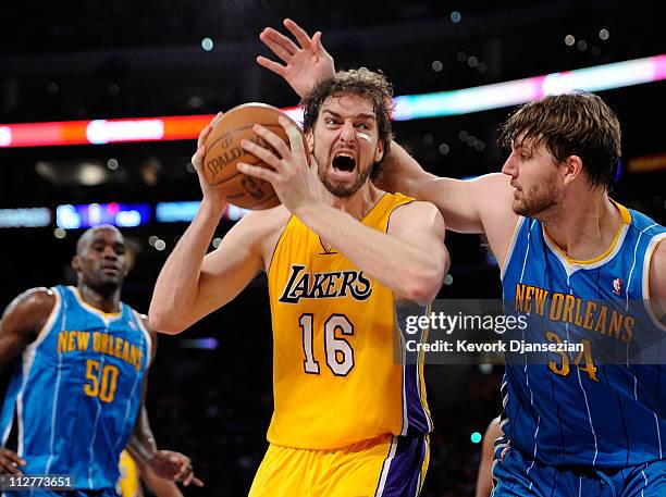 Pau Gasol of the Los Angeles Lakers goes up for a shot against Aaron Gray of the New Orleans Hornets in Game Two of the Western Conference...