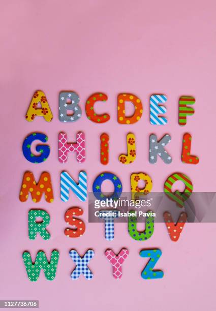 colorful alphabet on pink background - playful font stock pictures, royalty-free photos & images