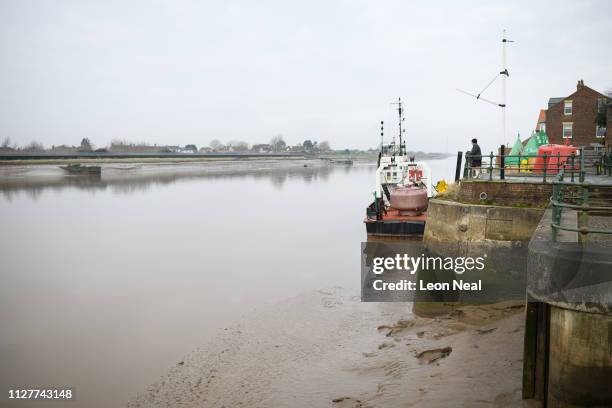 Man looks out on to the Great River Ouse from the entrance to the former harbour "Purfleet Quay" on February 05, 2019 in King's Lynn, England. The...