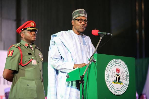 Nigerian President Muhammadu Buhari addresses the audience following his re-election, after Nigeria's Independent National Electoral Commission...