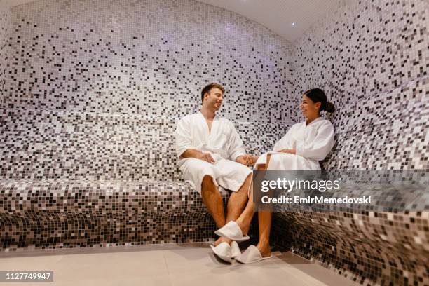 young couple relaxing in the steam bathroom or sauna - turkish bath stock pictures, royalty-free photos & images