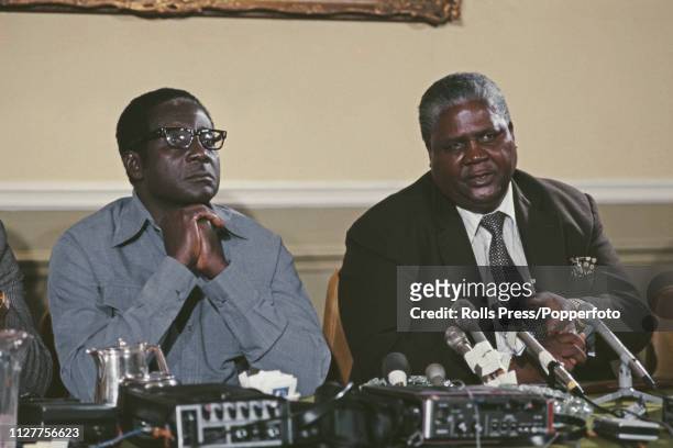 Robert Mugabe, leader of the Zimbabwe African National Union, pictured on left with Joshua Nkomo , leader of the Zimbabwe African Peple's Union at a...