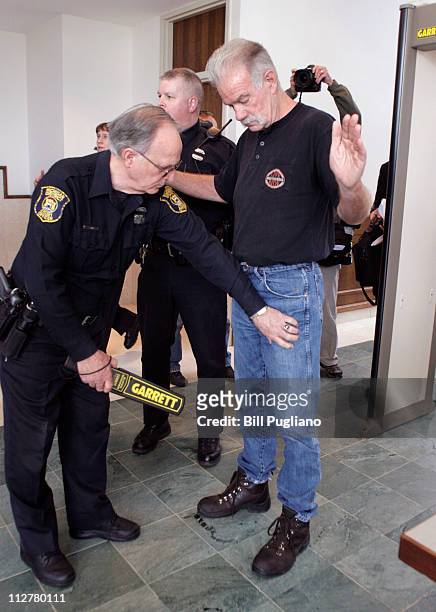 Pastor Terry Jones of Dove World Outreach Center goes through a security check before attending a hearing in 19th District Court April 21, 2011 in...
