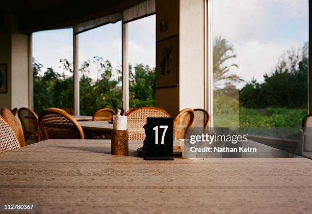 empty table set with the number 17 - hyatt hotels corp hotel ahead of earnings figures stockfoto's en -beelden